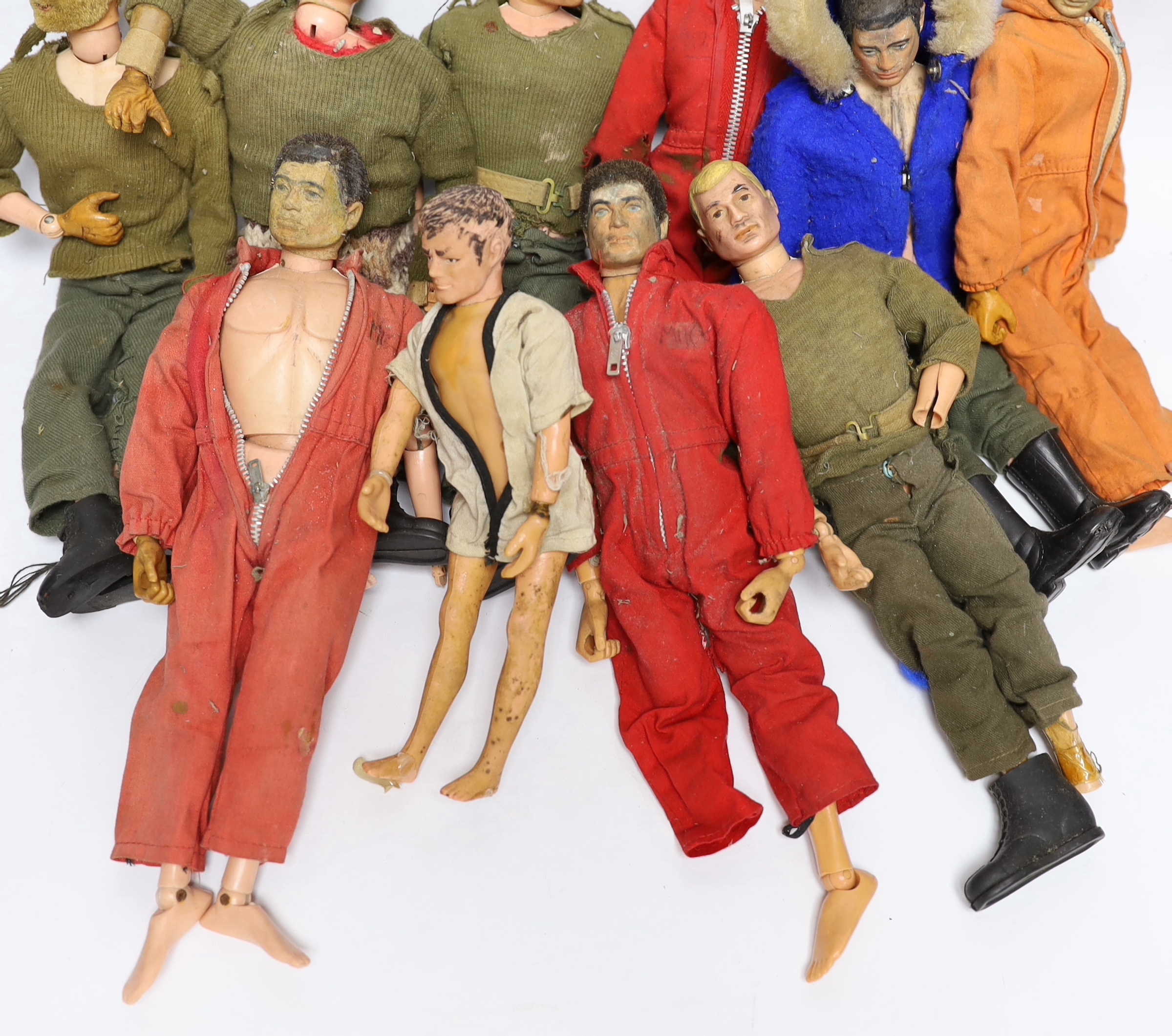 Nine 1960s/70s Action Man figures together with clothes and some accessories (a.f.)